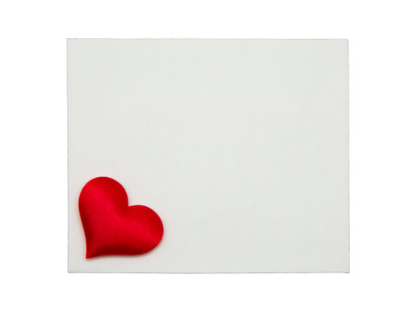 White card with red heart isolated on white backgroundの写真素材