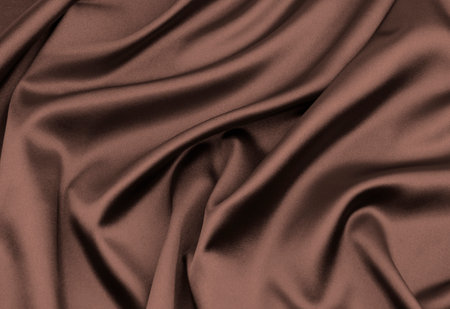 brown satin or silk fabric as backgroundの写真素材