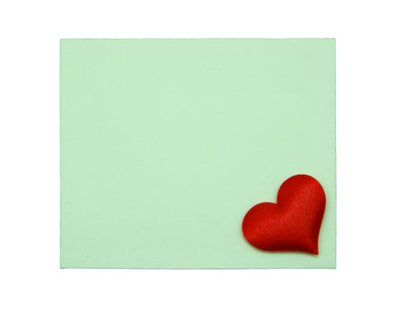 Green card with red heart isolated on white backgroundの写真素材
