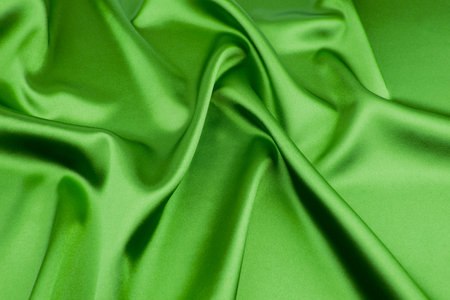 Green satin fabric as backgroundの写真素材