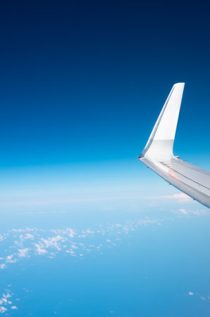 Airplane wing in the skyの写真素材