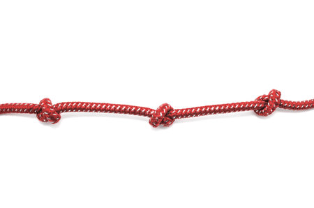 Rope with knots on white background