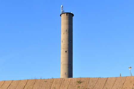 High round tower on background of blue sky の写真素材