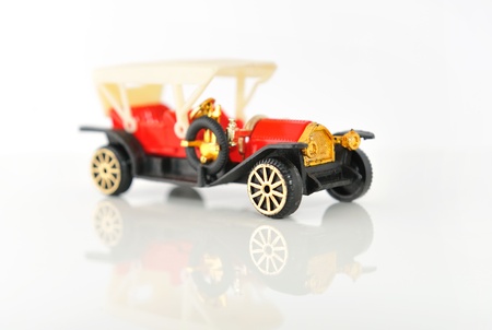 Plastic model of retro cars on white background with reflection の写真素材