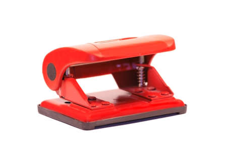 Red office puncher isolated over white. Shallow depth of field.の写真素材
