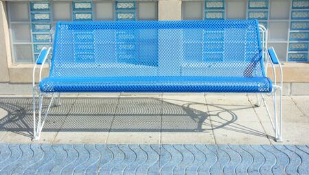 Tracery city bench dropping tracery shadow in sunny dayの写真素材