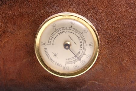 Old hydrometer on a leather case for cigarsの写真素材