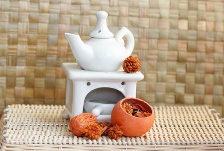 Fragrance lamp for meditation with dry aromatic flowers of orange colorの写真素材