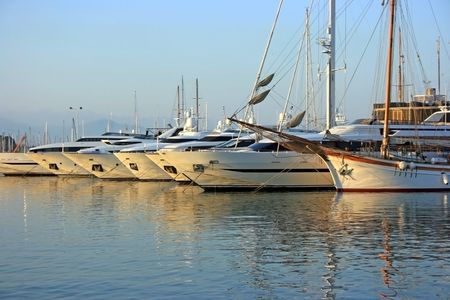 Modern and ancient yachts in port of Antibes (French riviera)