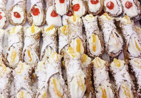Cannolo siciliano, typical sicilian sweet that is waffle pastry filled with ricotta-creamの写真素材
