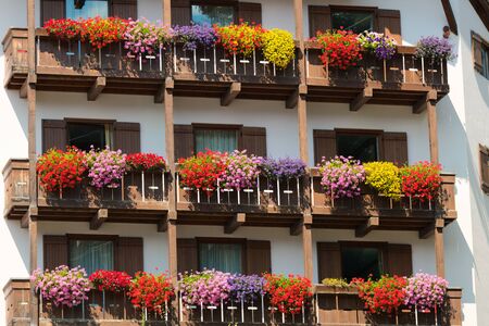Rustic windows decorated with flowers in Madonna di Campiglioの写真素材