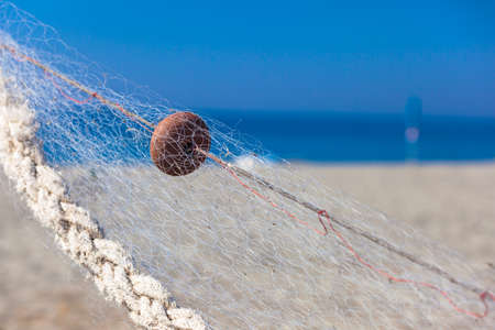 Detail of fishing net outdoors nearby the Mediterranean seaの写真素材