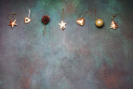 Christmas flat lay design with golden toys on a gray grunge background top viewの写真素材