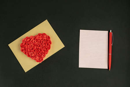 Love letter for Valentine's Day. Envelope with hearts on a dark background.