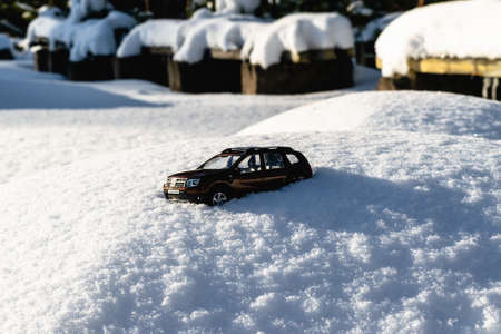 Vitebsk, Belarus - February 2021: Renault Duster toy model on a snowdrift. Extreme off-road driving concept, 4x4. Horizontal photo.のeditorial素材