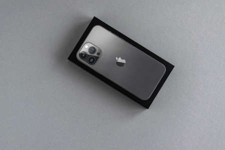 Minsk, Belarus - March 2022: Apple iPhone 13 Pro Max. The phone is new to the iPhone line. On a gray...