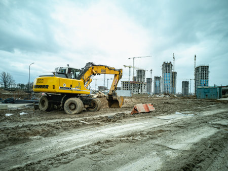 Minsk, Belarus - May 2022: Liebherr 900 wheel excavator at the construction site of a new residential microdistrict.のeditorial素材