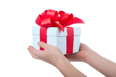 Hands holding beautiful gift box, female giving giftの写真素材