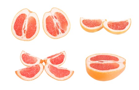 Slices Grapefruit cut in half, isolated on a white background.