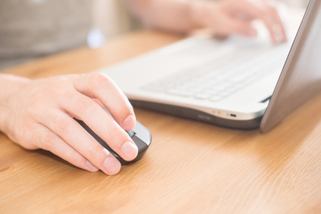 Hands typing on a notebook closeup. Workplace.の写真素材