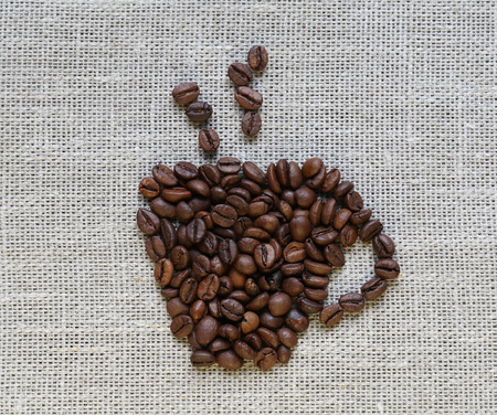 coffee Cup made of beans on linenの写真素材