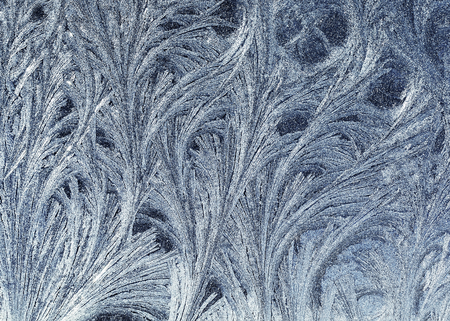 Christmas shiny pattern frost on the glass of vitawater drawings and curls