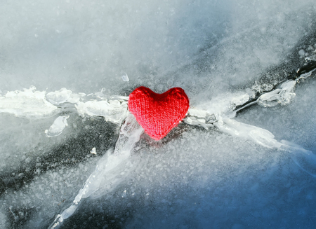beautiful bright heart yarn is melted with heat and love the cold blue crack in the iceの写真素材