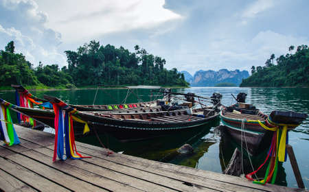 Thai boats at the pier on lake Cheo LANの写真素材