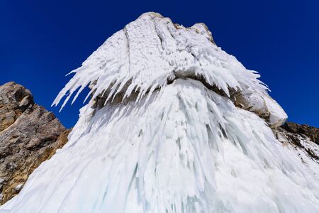 ice splashing on the shore of lake