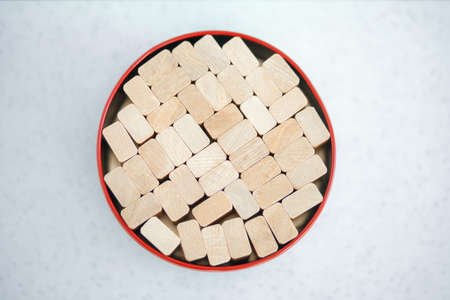 wooden bars laid out in an iron box, symbolize order. Concept.の写真素材