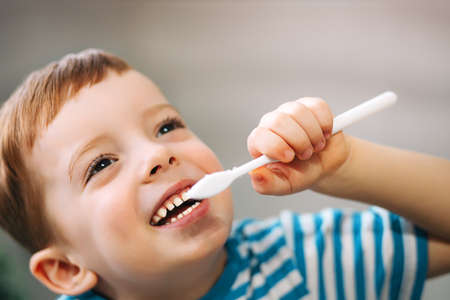 boy brushing his teeth, close-up.