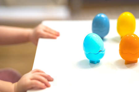the baby plays and learns colors, develops fine motor skills of the handsの写真素材