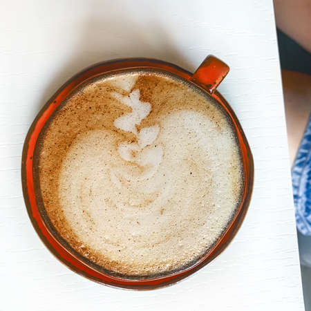 Cappuccino flatly on white table, lifestyle.の写真素材
