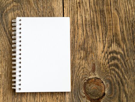 Billboard with blank sheet for notes in abstract blank wooden background. Notebook with empty space.の写真素材