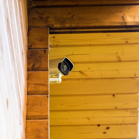 hidden surveillance camera on the front of the house.