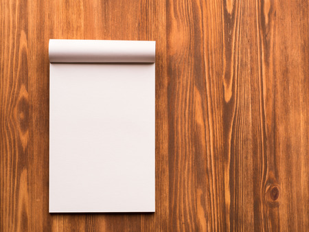 Billboard with blank sheet for notes in abstract blank wooden background. Notebook with empty space.の写真素材