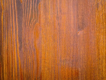 background and texture of brown pine wood, covered with toning oilの写真素材