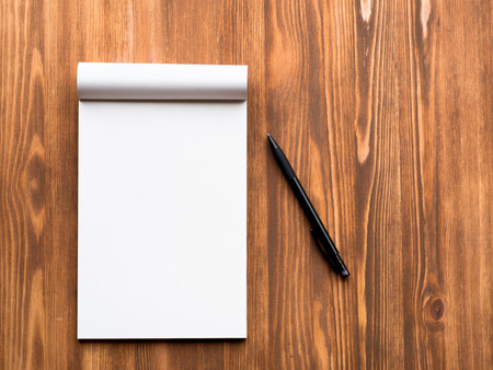 Billboard with blank sheet for notes and pencil in abstract blank wooden background. Notebook with empty space.の写真素材