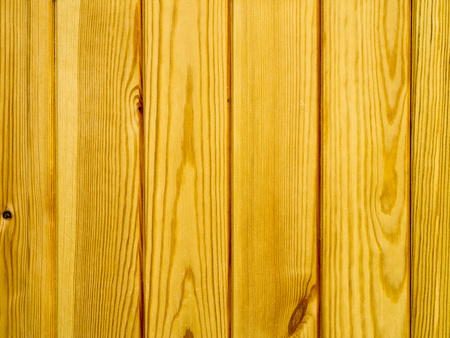 the background of new wood lacquered pine boardsの写真素材