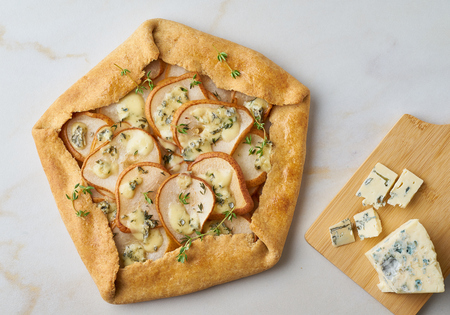 Pear galett with a blue cheese, savory pie, marble table, top viewの写真素材