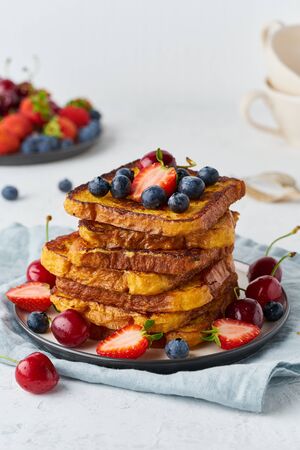 healthy french toasts with berries, confort stack of toasts, homemade briocheの写真素材