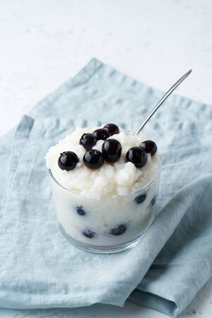 Vegan Coconut Rice Pudding with a blueberry, gluten free dessertの写真素材