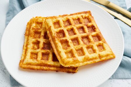 Chaffle, ketogenic diet health food. Homemade keto waffles with egg, mozzarella cheese. Gluten -...