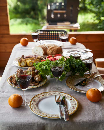 Holiday table full of food grill on backgroundの写真素材