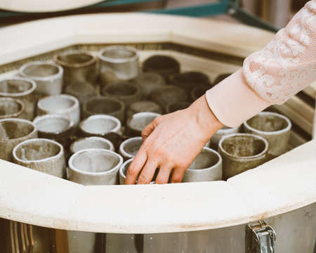 Manufacture of ceramic products, workpiece. Background with ceramic pieces of ware. Clay oven