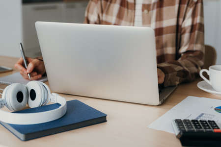 Online shopping, online learning, work at home. Distance education. Woman typing to blog on laptop....