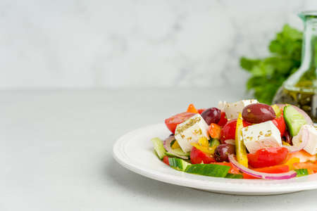 Delicious greek village horiatiki salad on plate. Mediterranean Greece lunch. Horizontal, copy spaceの写真素材