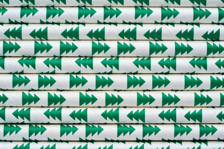 Eco paper recyclable straws pattern. Green trees design. Closeup of disposal assortmentの写真素材