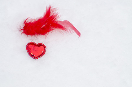 red heart on snow, a holiday of all loversの写真素材