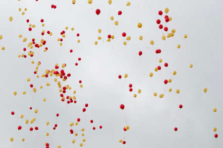 Background texture balloons in the sky red and yellowの写真素材